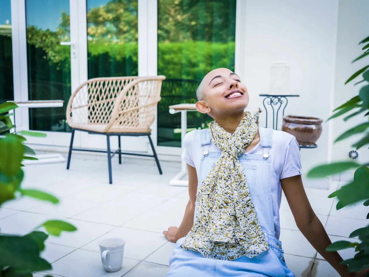 Woman relaxing on a bright terrace, photographed by GCShutter